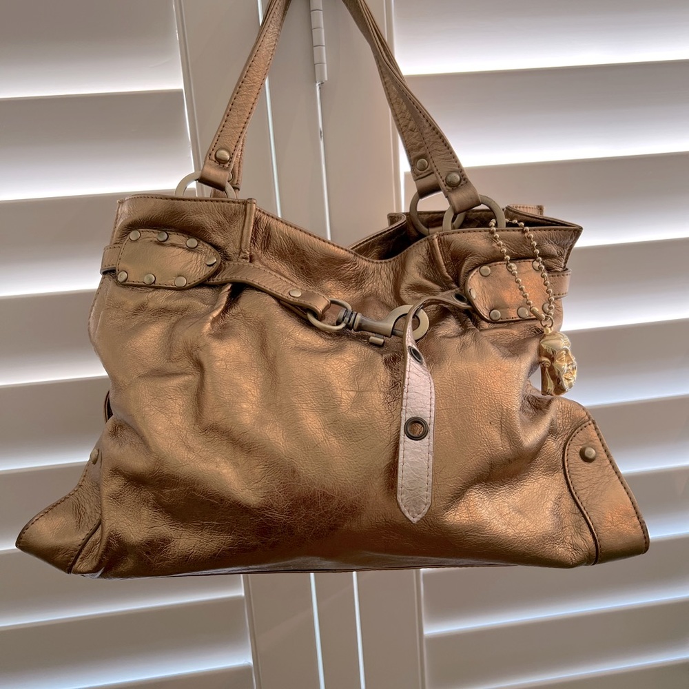 Gently used Big Buddha gold handbag.
